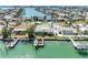 Waterfront property features a private dock and boat lift, offering direct access to the bay at 540 115Th Ave, Treasure Island, FL 33706