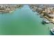 Expansive waterfront view showcases the calm waters and the community's serene coastal living at 540 115Th Ave, Treasure Island, FL 33706
