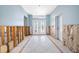Entryway featuring a tile floor, blue walls, and a decorative glass door at 540 115Th Ave, Treasure Island, FL 33706