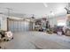 Wide garage with an automatic door, storage shelves and a window for natural light at 540 115Th Ave, Treasure Island, FL 33706