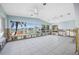 Bright living room with tile floors, waterfront views and sliding glass doors at 540 115Th Ave, Treasure Island, FL 33706