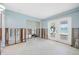 Bright living room with waterfront views and white-framed French doors leading to the outdoor space at 540 115Th Ave, Treasure Island, FL 33706