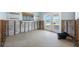 Bright living room with partial construction work in progress, featuring a view to the canal at 540 115Th Ave, Treasure Island, FL 33706