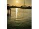 Sunset on the water with boats docked along the canal at 540 115Th Ave, Treasure Island, FL 33706