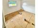 Renovation-ready bedroom features bright natural light, offering a blank canvas for customization at 5715 Townhouse Dr # 1, New Port Richey, FL 34652