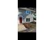 Charming two-story home features a red front door, well-maintained lawn, and clean architectural lines at 5715 Townhouse Dr # 1, New Port Richey, FL 34652