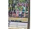 Festive float in a parade with decorative flourishes and several excited participants at 5715 Townhouse Dr # 1, New Port Richey, FL 34652
