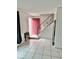 Bright entry foyer with tiled floor and staircase, offering a welcoming space with potential at 5715 Townhouse Dr # 1, New Port Richey, FL 34652