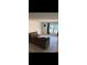 Inviting living room featuring tile flooring and bright windows, providing a comfortable space at 5715 Townhouse Dr # 1, New Port Richey, FL 34652