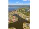 Scenic aerial shot showcasing luxurious waterfront homes with private pools and scenic water views at 6181 9Th Avenue Ne Cir, Bradenton, FL 34212