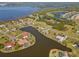 Gorgeous aerial view of waterfront homes along winding canals with golf course views at 6181 9Th Avenue Ne Cir, Bradenton, FL 34212