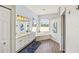 Bathroom featuring double sinks, large mirrors, bright lighting, and a soaking tub at 6181 9Th Avenue Ne Cir, Bradenton, FL 34212
