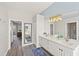 Bright bathroom featuring double sink vanity with quartz counters, undermount sinks, and modern lighting at 6181 9Th Avenue Ne Cir, Bradenton, FL 34212