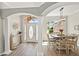 Inviting dining room featuring stylish lighting, wood floors, and architectural columns and archways at 6181 9Th Avenue Ne Cir, Bradenton, FL 34212