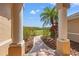 Covered front entrance with columns and walkway surrounded by landscaping, showcasing outdoor charm at 6181 9Th Avenue Ne Cir, Bradenton, FL 34212