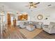 An open-concept living room flows into the kitchen and dining area at 6181 9Th Avenue Ne Cir, Bradenton, FL 34212