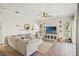 Comfortable living room with neutral decor, wood floors, and ample natural light at 6181 9Th Avenue Ne Cir, Bradenton, FL 34212