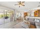 Open floor plan with sliding glass doors to the patio and views of the living room and kitchen at 6181 9Th Avenue Ne Cir, Bradenton, FL 34212