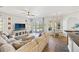 Spacious living room with views of the pool and patio; featuring neutral decor at 6181 9Th Avenue Ne Cir, Bradenton, FL 34212
