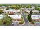 Overhead view of a residential community featuring well-maintained grounds, a pool, and ample parking at 6188 Chesham Dr # 5, New Port Richey, FL 34653