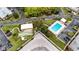 Overhead angle of the pool and recreation area with shuffleboard courts at 6188 Chesham Dr # 5, New Port Richey, FL 34653