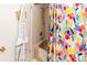 Cozy bathroom featuring a shower with colorful curtain at 6188 Chesham Dr # 5, New Port Richey, FL 34653