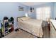 Comfortable bedroom with blue walls, warm bedding, and a shoe rack for organized storage at 6188 Chesham Dr # 5, New Port Richey, FL 34653