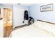Inviting bedroom showcasing a closet and a view into the tiled bathroom at 6188 Chesham Dr # 5, New Port Richey, FL 34653