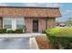 Close-up of the front door with decorative accents and well-maintained landscaping at 6188 Chesham Dr # 5, New Port Richey, FL 34653