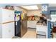 Functional kitchen with white cabinetry, stainless steel appliances, and ample counter space at 6188 Chesham Dr # 5, New Port Richey, FL 34653