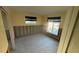 Renovated bedroom featuring two windows for natural light, offering potential at 6526 Senegal Palm Way, Apollo Beach, FL 33572