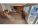 Partially renovated kitchen space with tile flooring and large windows looking out onto the screened patio at 6526 Senegal Palm Way, Apollo Beach, FL 33572
