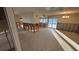 Spacious living room with tile flooring and access to an outdoor pool and patio at 6526 Senegal Palm Way, Apollo Beach, FL 33572
