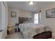 Comfortable bedroom with a dark wood bed, soft lighting, and a calming color scheme at 6632 Laxey Ct, Zephyrhills, FL 33541