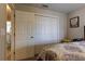 This bedroom features a double closet and a comfortable bed, perfect for relaxation at 6632 Laxey Ct, Zephyrhills, FL 33541