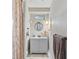 A clean bathroom featuring a modern vanity and shower area with a patterned curtain at 904 Woodland Dr, Seffner, FL 33584