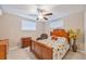 Cozy bedroom with natural light, ceiling fan, and tiled floor at 904 Woodland Dr, Seffner, FL 33584
