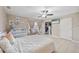 Comfortable bedroom features a ceiling fan, crib and serene decor at 904 Woodland Dr, Seffner, FL 33584