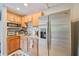 Bright kitchen features stainless steel appliances, tile backsplash, and granite countertops at 904 Woodland Dr, Seffner, FL 33584
