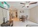 A cozy living space with a dining area, kitchen, and entertainment setup at 904 Woodland Dr, Seffner, FL 33584