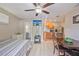 Open living area featuring a dining table, kitchen, and TV; creating a functional and inviting space at 904 Woodland Dr, Seffner, FL 33584