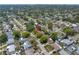 Drone shot of neighborhood, house indicated by red arrow at 9044 Lynwood Dr, Seminole, FL 33772