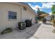 The back patio is ideal for grilling and has an outdoor table for dining at 9044 Lynwood Dr, Seminole, FL 33772