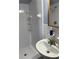 Bathroom view showcasing shower stall and sink with a mirrored reflection of the shower head at 9044 Lynwood Dr, Seminole, FL 33772