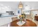 Light-filled dining area connecting the kitchen and living spaces, perfect for entertaining at 9044 Lynwood Dr, Seminole, FL 33772