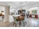 Charming dining area with a classic table, mirrored wall, and view of an adjacent study room at 9044 Lynwood Dr, Seminole, FL 33772