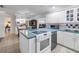 Bright kitchen featuring a blue countertop island, and view to dining and study rooms at 9044 Lynwood Dr, Seminole, FL 33772