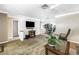Cozy living room with tile floors, open layout, and comfortable seating arrangement at 9044 Lynwood Dr, Seminole, FL 33772