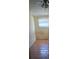 Compact bedroom with hardwood floors and a window with natural lighting at 1015 23Rd W Ave, Bradenton, FL 34205