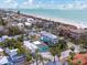 Beautiful aerial view of beach homes close to white sand beach and blue ocean waters at 106 23Rd Ave, St Pete Beach, FL 33706